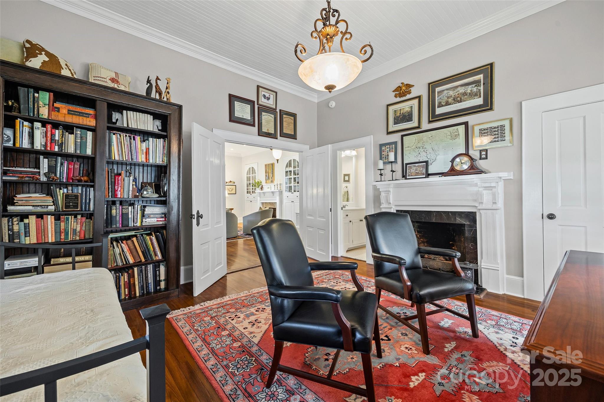 12 Wright Avenue York, SC 29745 - Photo 10 of 29 a dining room with furniture a book shelves and a chandelier