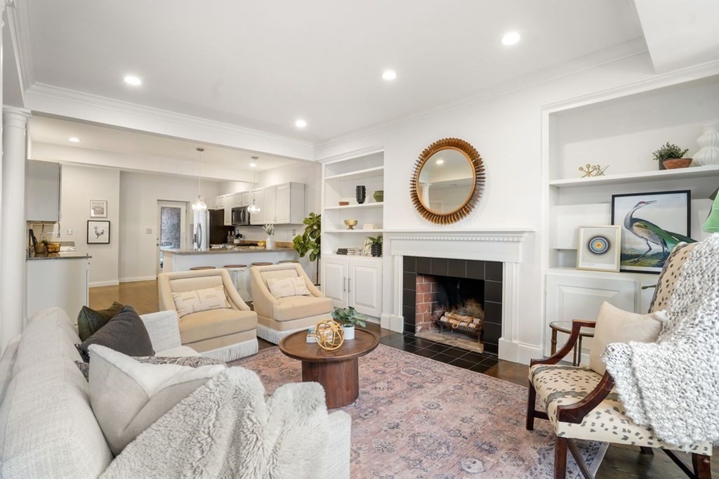 a living room with furniture and a fireplace