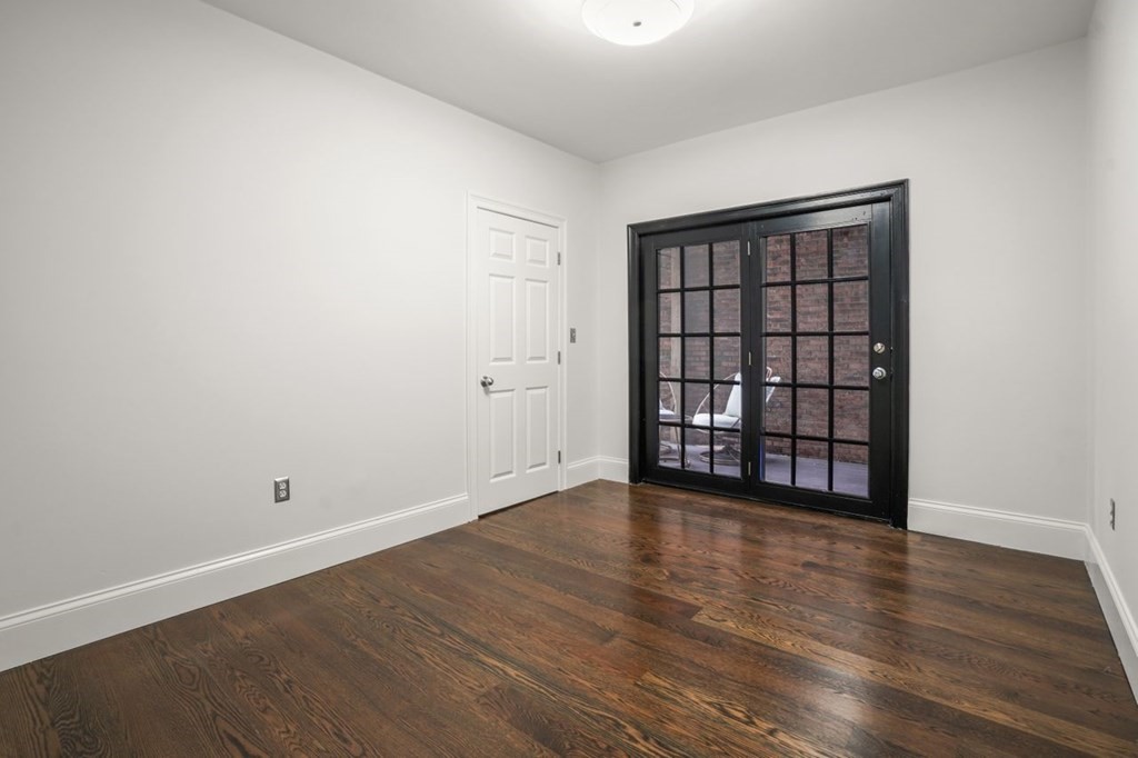 11 Union Street, Unit 2 Boston, MA 02129 - Photo 14 of 22 a view of an empty room with wooden floor and a window