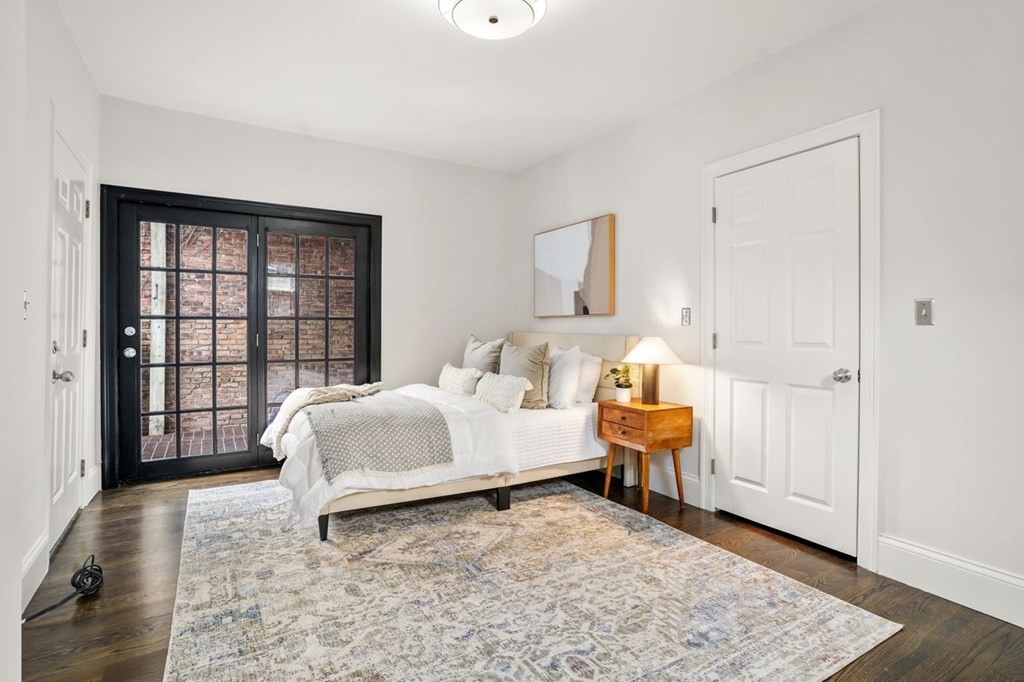 11 Union Street, Unit 2 Boston, MA 02129 - Photo 17 of 22 a spacious bedroom with a bed and a window