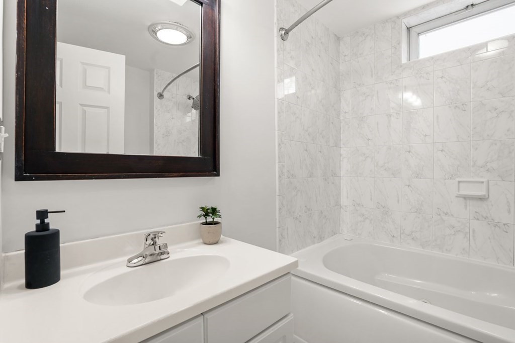 11 Union Street, Unit 2 Boston, MA 02129 - Photo 18 of 22 a bathroom with a sink a toilet and a mirror