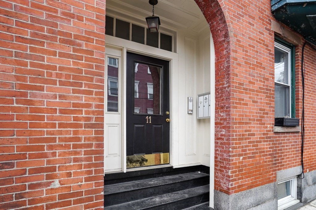 11 Union Street, Unit 2 Boston, MA 02129 - Photo 22 of 22 a building view with a glass door
