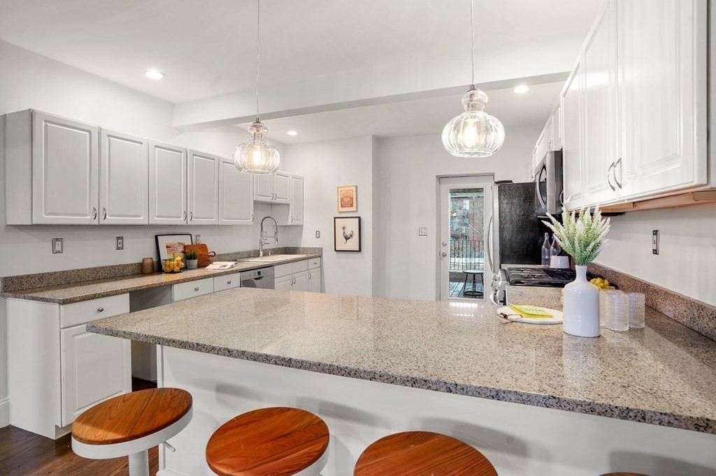 11 Union Street, Unit 2 Boston, MA 02129 - Photo 3 of 22 a kitchen with stainless steel appliances granite countertop a granite counter tops and a view of living room