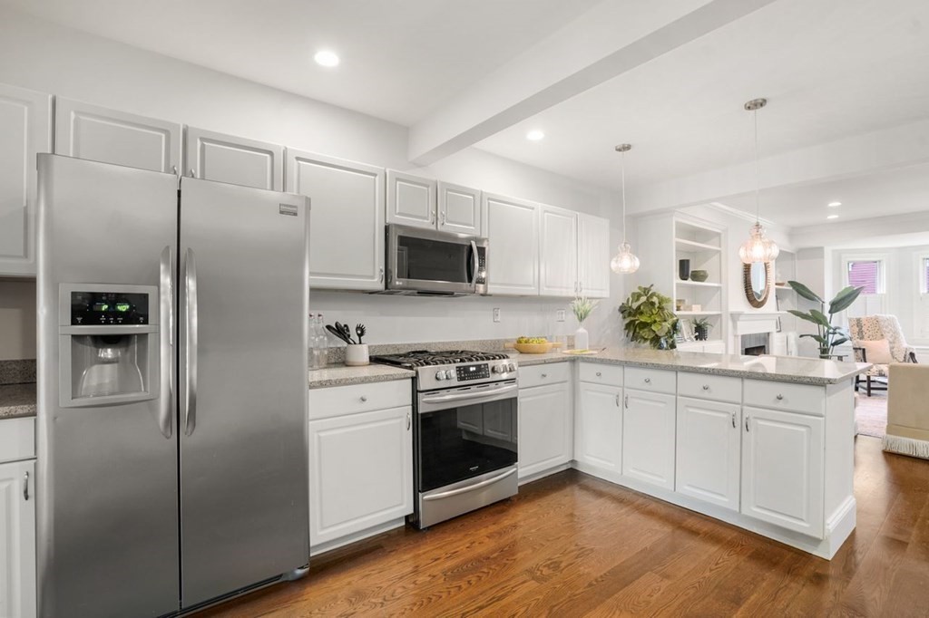 11 Union Street, Unit 2 Boston, MA 02129 - Photo 5 of 22 a kitchen with stainless steel appliances a refrigerator sink and microwave