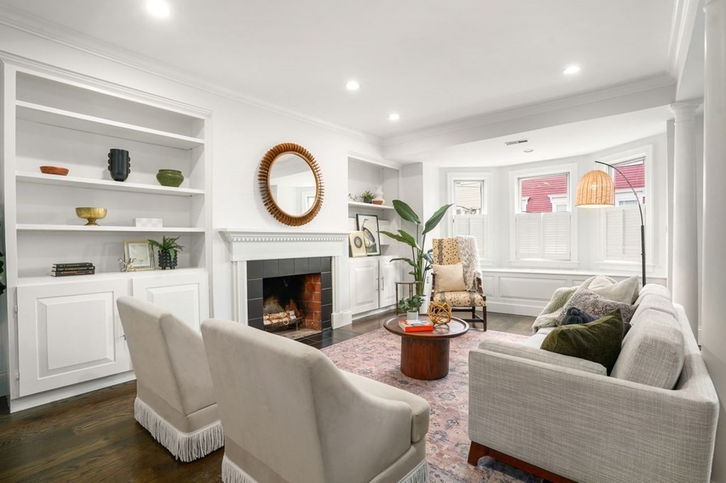 11 Union Street, Unit 2 Boston, MA 02129 - Photo 8 of 22 a living room with furniture and a fireplace