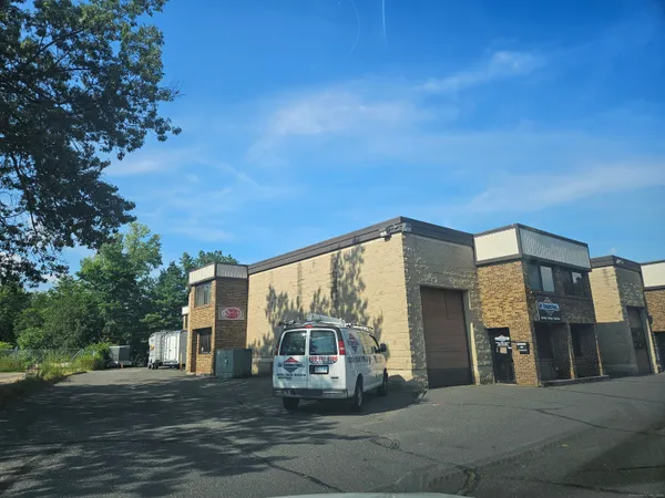 a view of a car park in front of a building