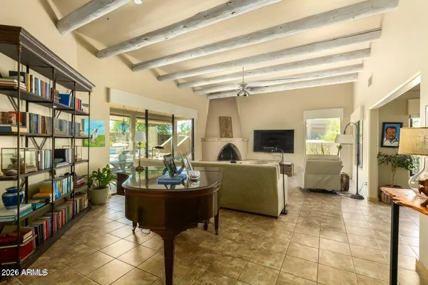 a living room with furniture and a potted plant