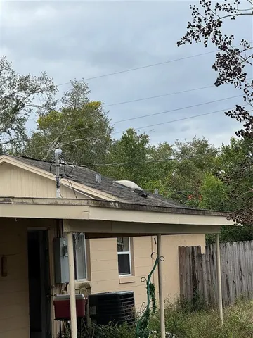 a backyard of a house with lots of green space