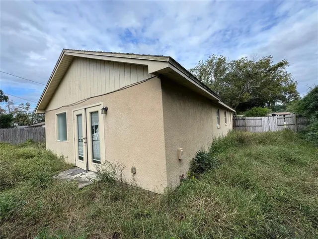 a backyard of a house with lots of green space