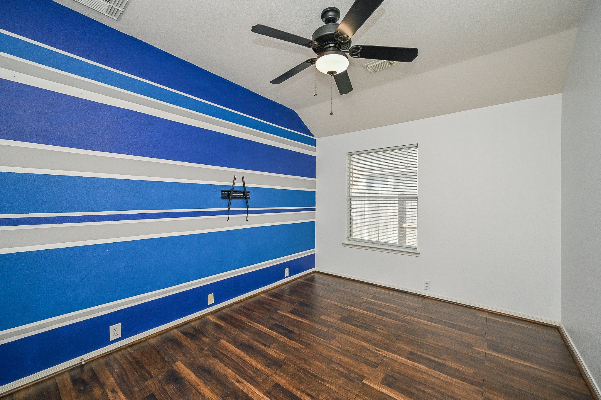 2726 Redwick Drive Spring, TX 77388 - Photo 18 of 32 a view of room with a ceiling fan and wooden floor