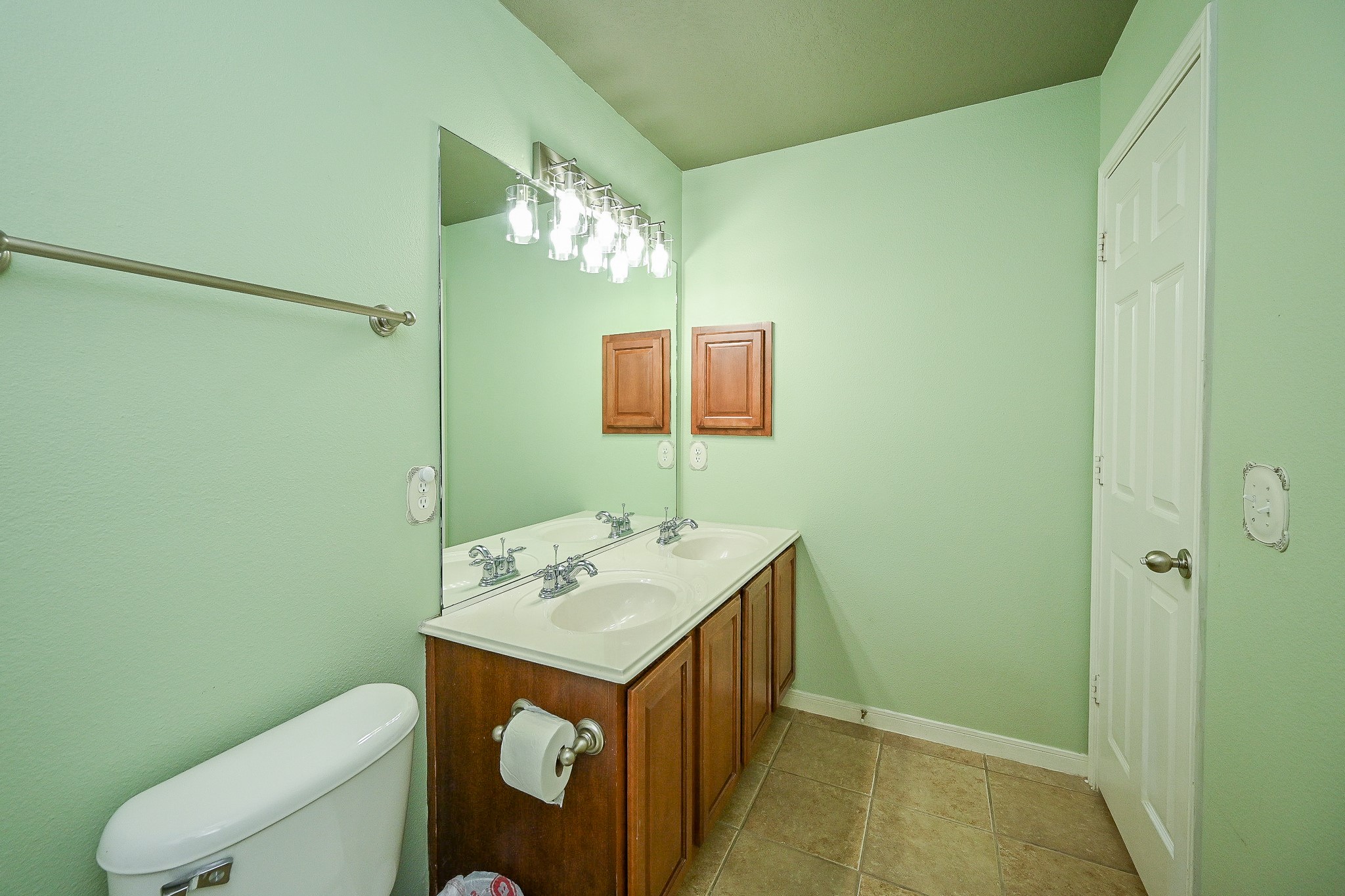 2726 Redwick Drive Spring, TX 77388 - Photo 21 of 32 a bathroom with a sink a toilet and mirror