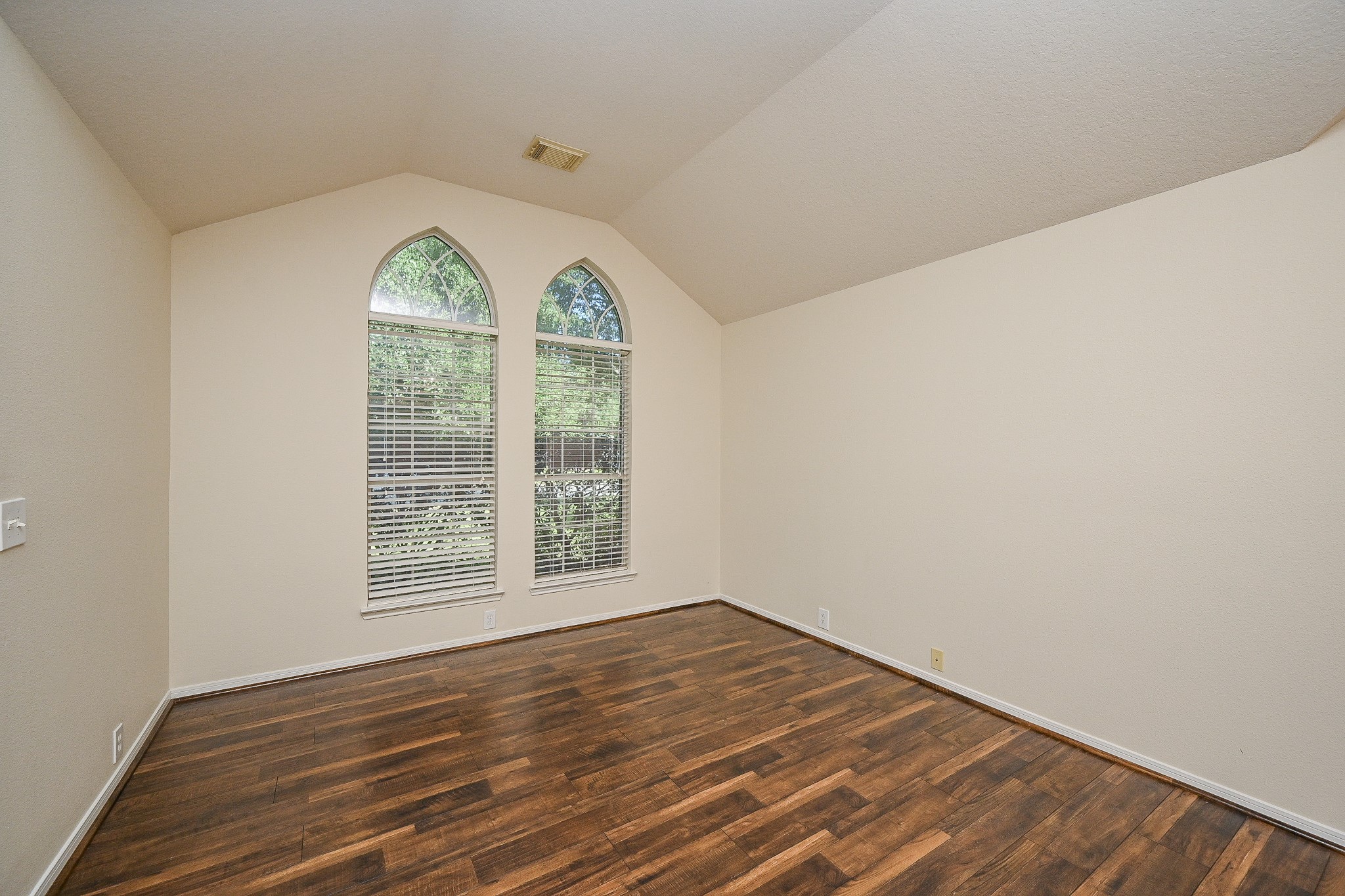 2726 Redwick Drive Spring, TX 77388 - Photo 6 of 32 an empty room with wooden floor and windows