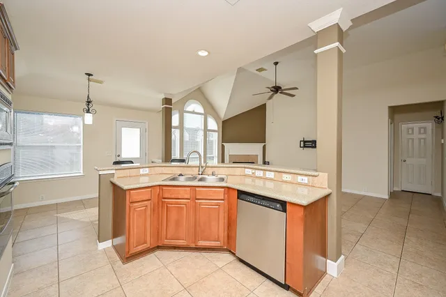 a kitchen with a sink and cabinets