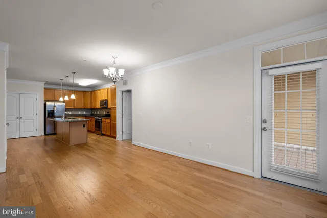 a view of a kitchen with a sink and cabinets