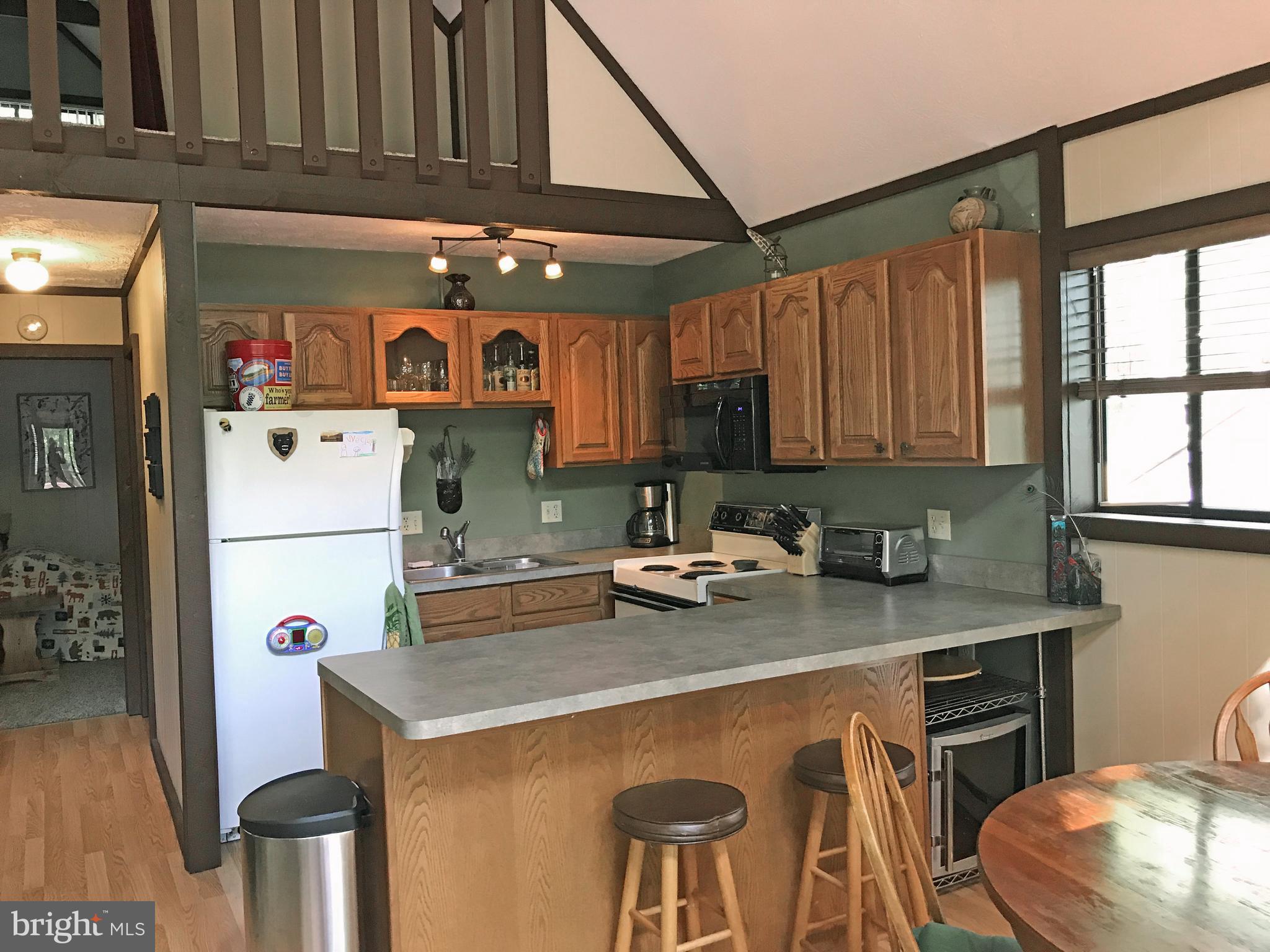 335 Connie Road Basye, VA 22810 - Photo 17 of 30 Kitchen with breakfast bar and dining room