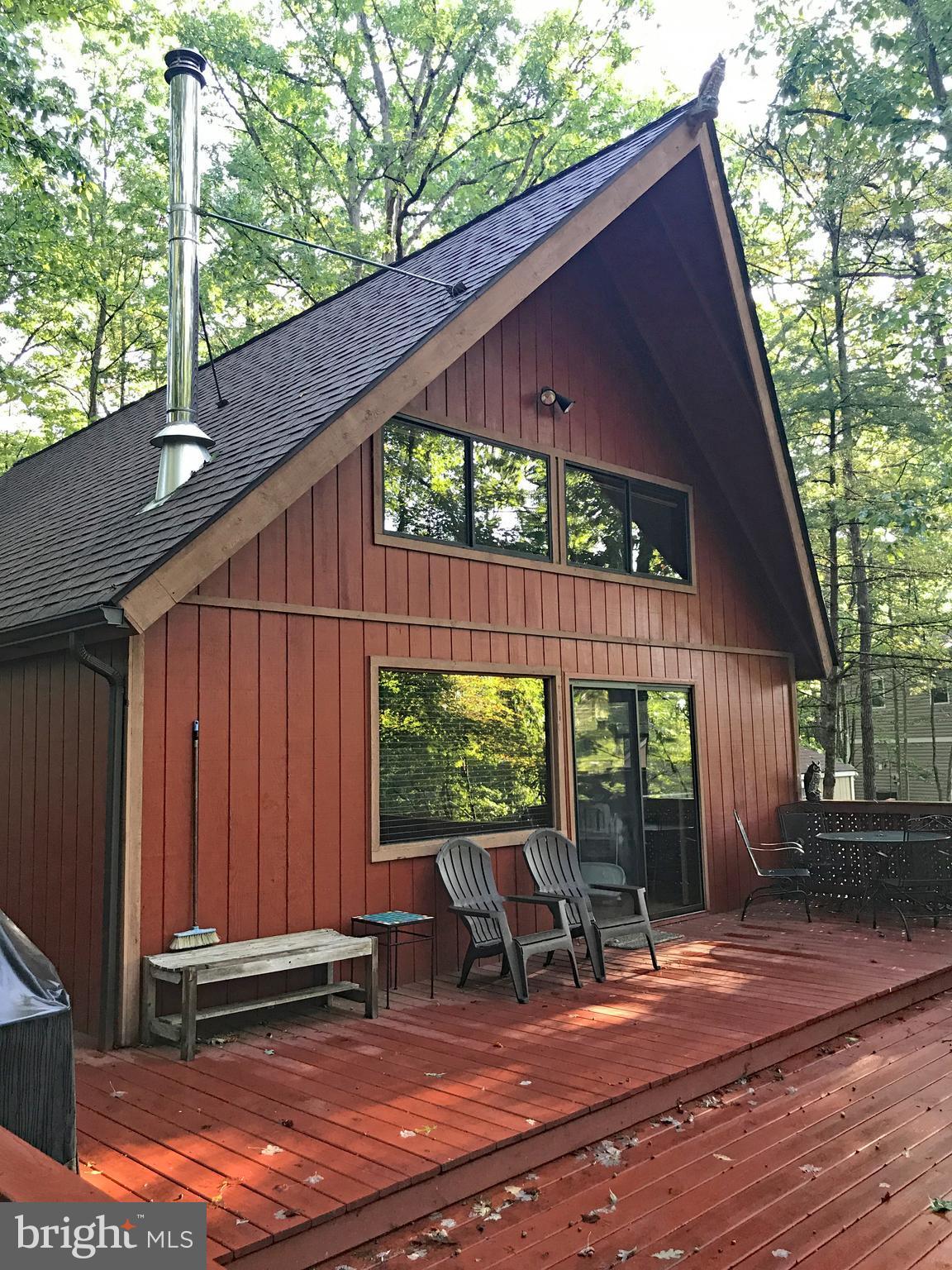 335 Connie Road Basye, VA 22810 - Photo 5 of 30 Back of cabin with large windows on woodland views