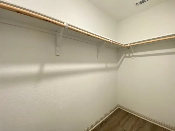 a bathroom with a shower and a glass door