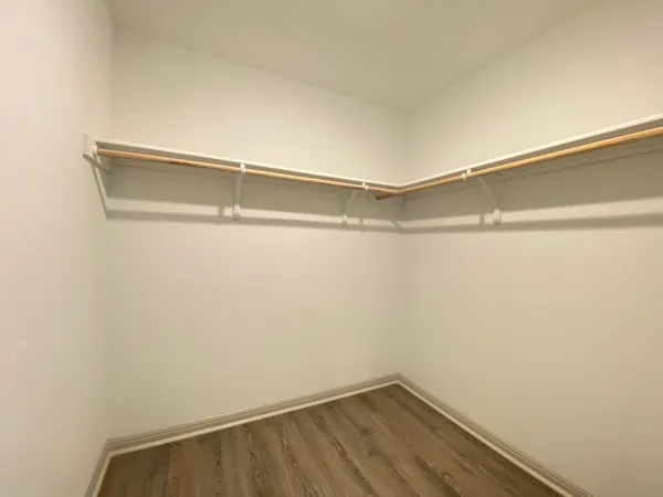a bathroom with a double vanity sink and mirror