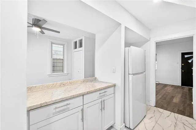 a kitchen with a refrigerator and countertop