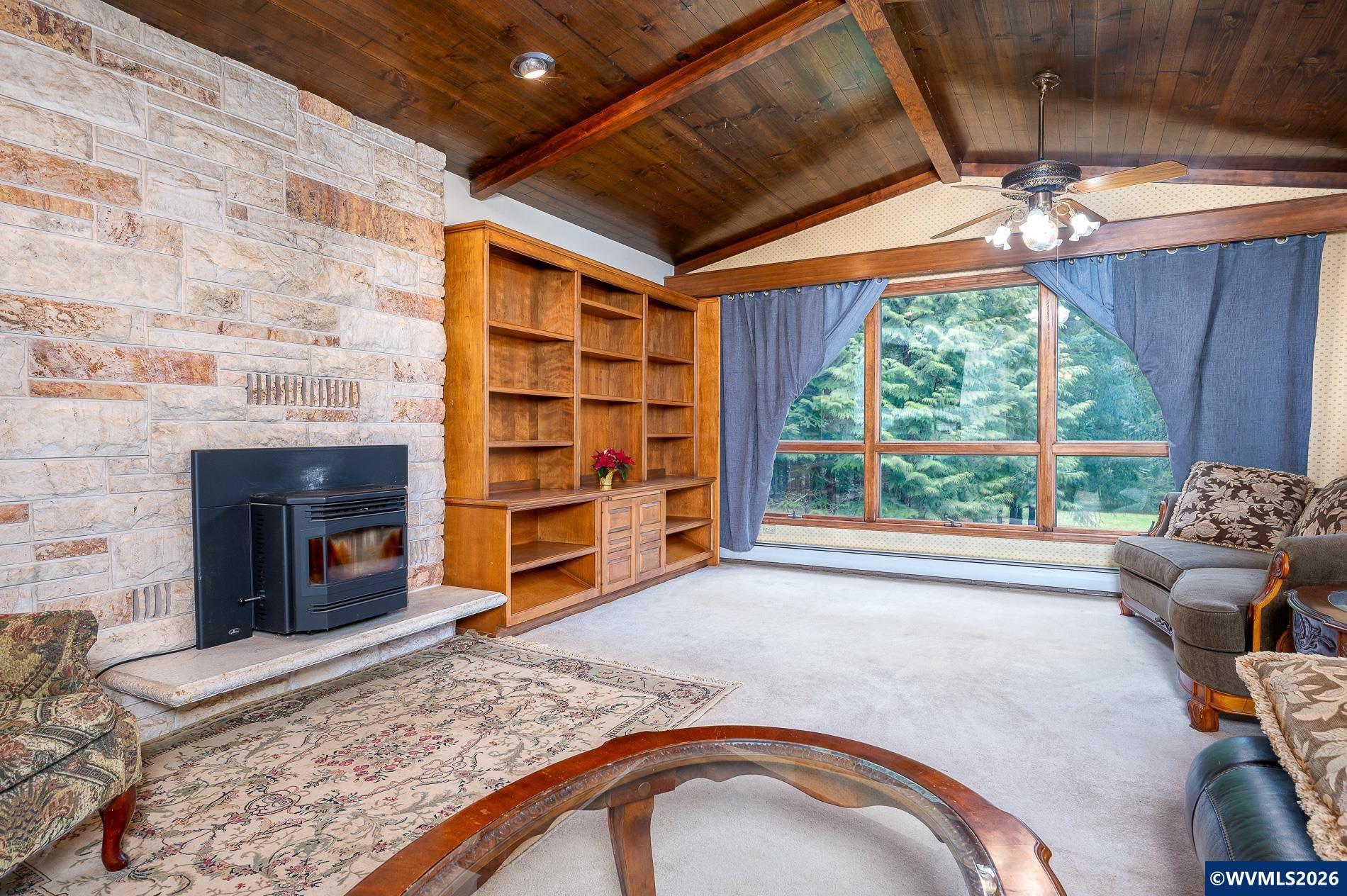 27572 South Kinzy Road Estacada, OR 97023 - Photo 8 of 50 a bedroom with furniture and a fireplace
