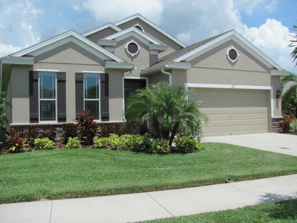 129 Star Shell Drive Apollo Beach, FL 33572 - Photo 1 of 1 Beautiful brick accents compliment the front of the home.