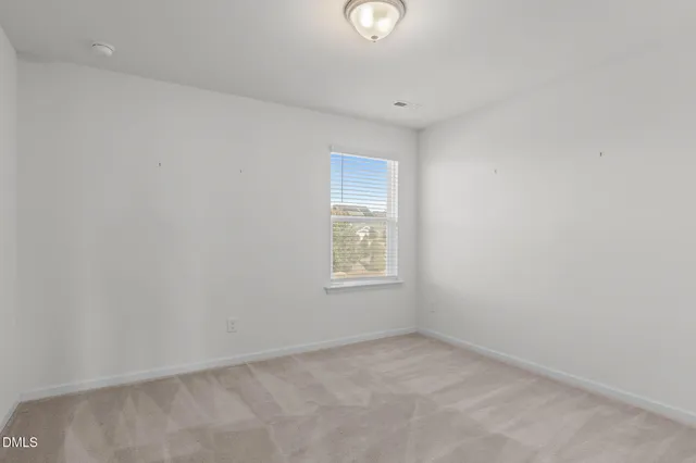a spacious bathroom with a double vanity sink mirror and shower