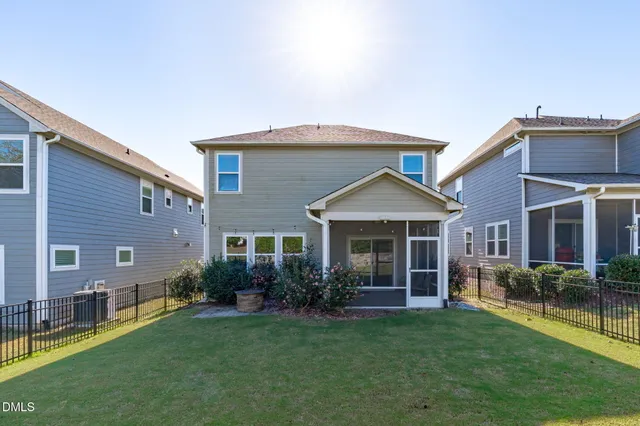 a utility room with a sink and a washing machine