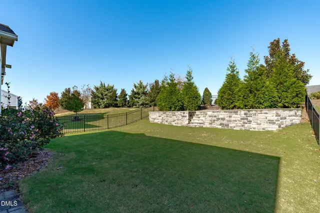 a view of a swimming pool with a yard