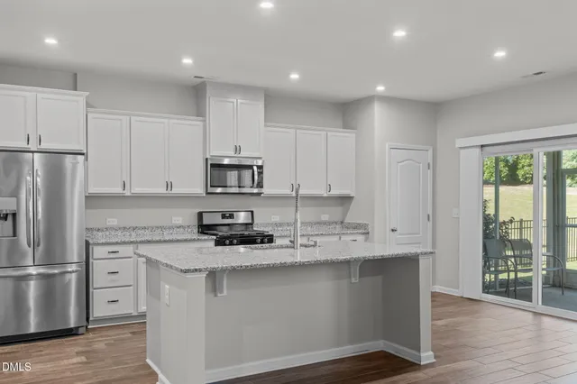 a view of livingroom with fireplace flat screen tv and window