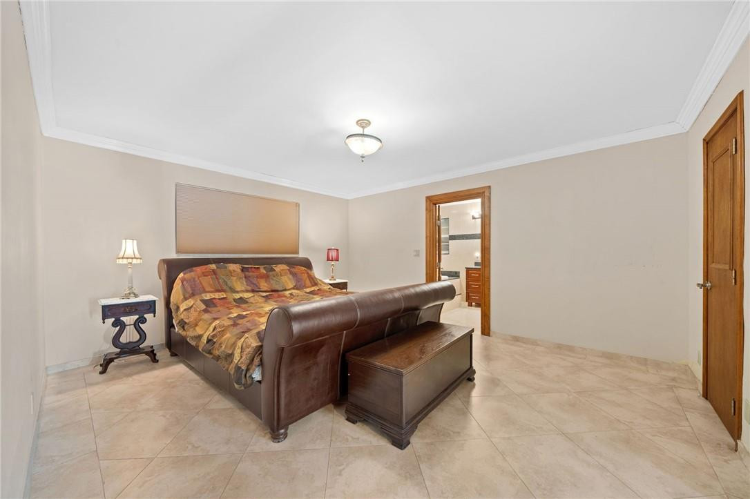 3800 North Park Road Hollywood, FL 33021 - Photo 20 of 27 a bedroom with a bed lamp closet and window