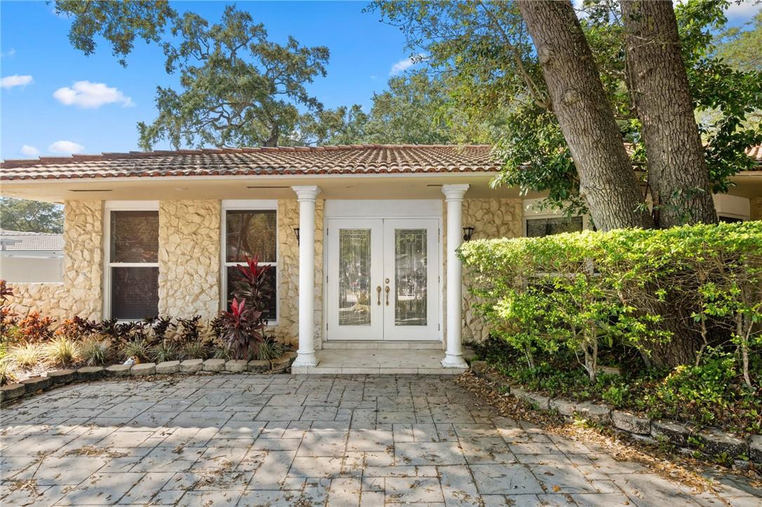 3800 North Park Road Hollywood, FL 33021 - Photo 2 of 27 a front view of a house with garden