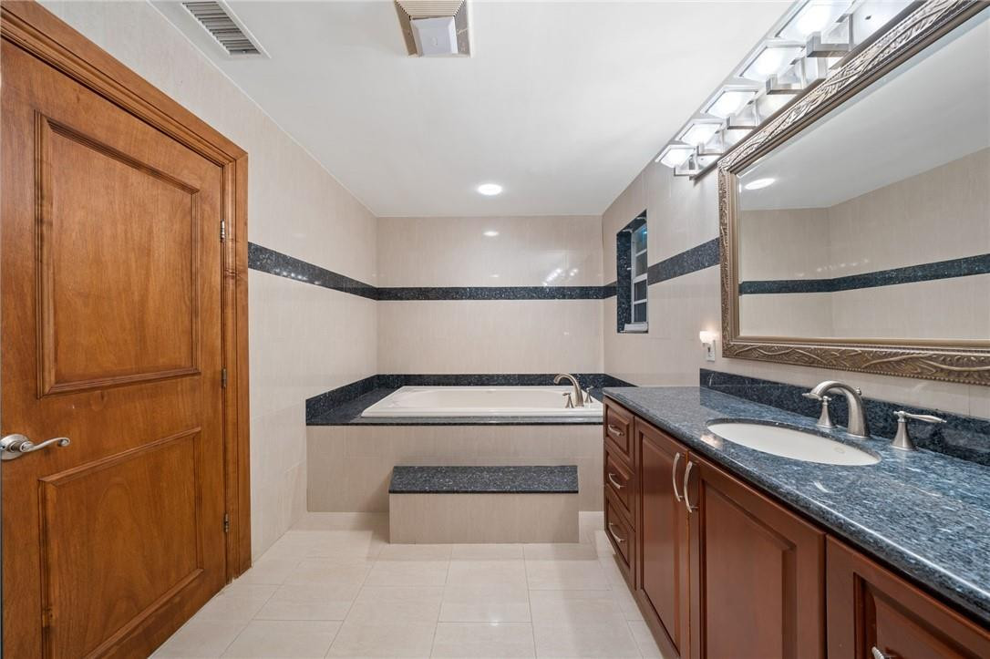 3800 North Park Road Hollywood, FL 33021 - Photo 21 of 27 a bathroom with 2 sink and a bathtub