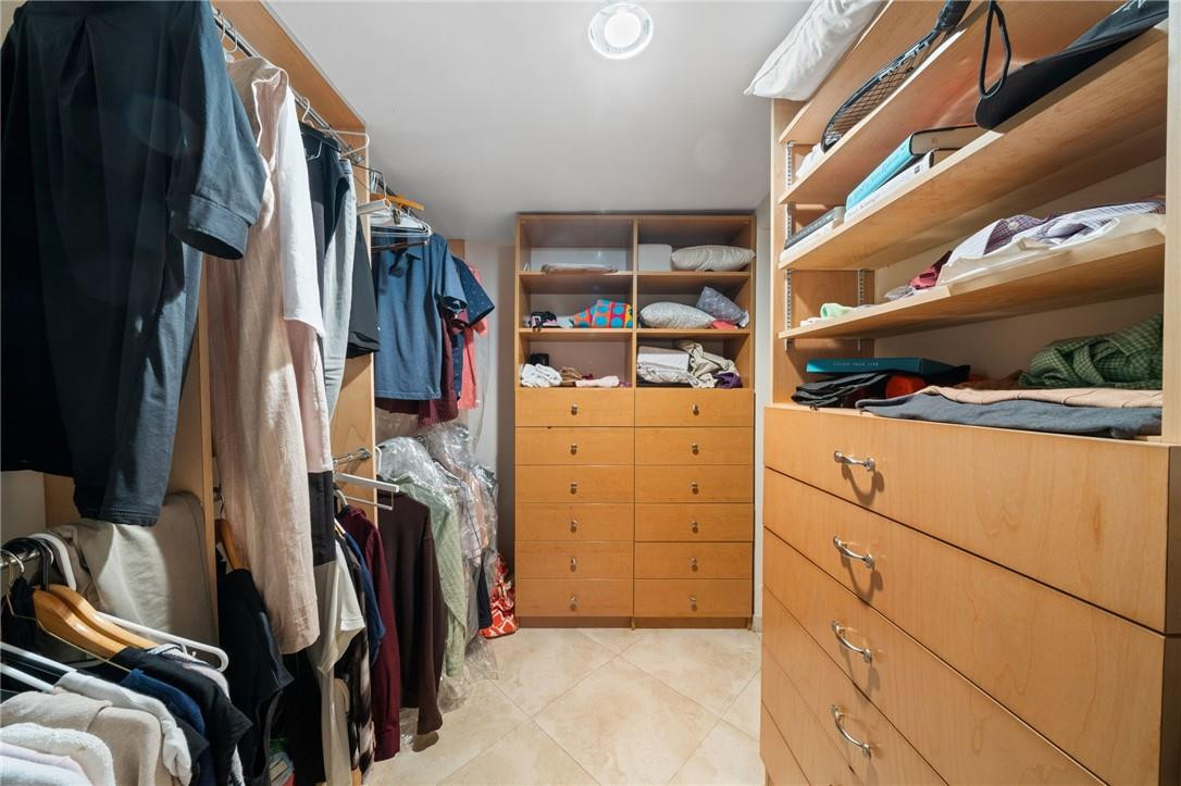 3800 North Park Road Hollywood, FL 33021 - Photo 24 of 27 a view of walk in closet with clothes