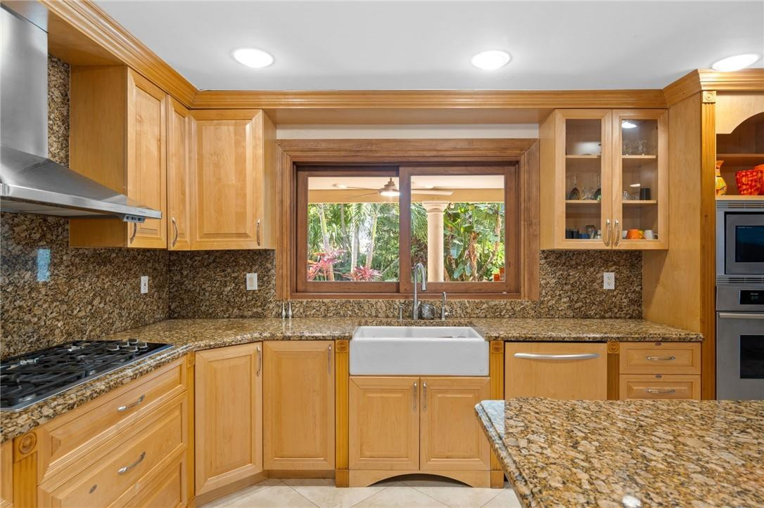 3800 North Park Road Hollywood, FL 33021 - Photo 9 of 27 a kitchen with granite countertop a sink cabinets and window