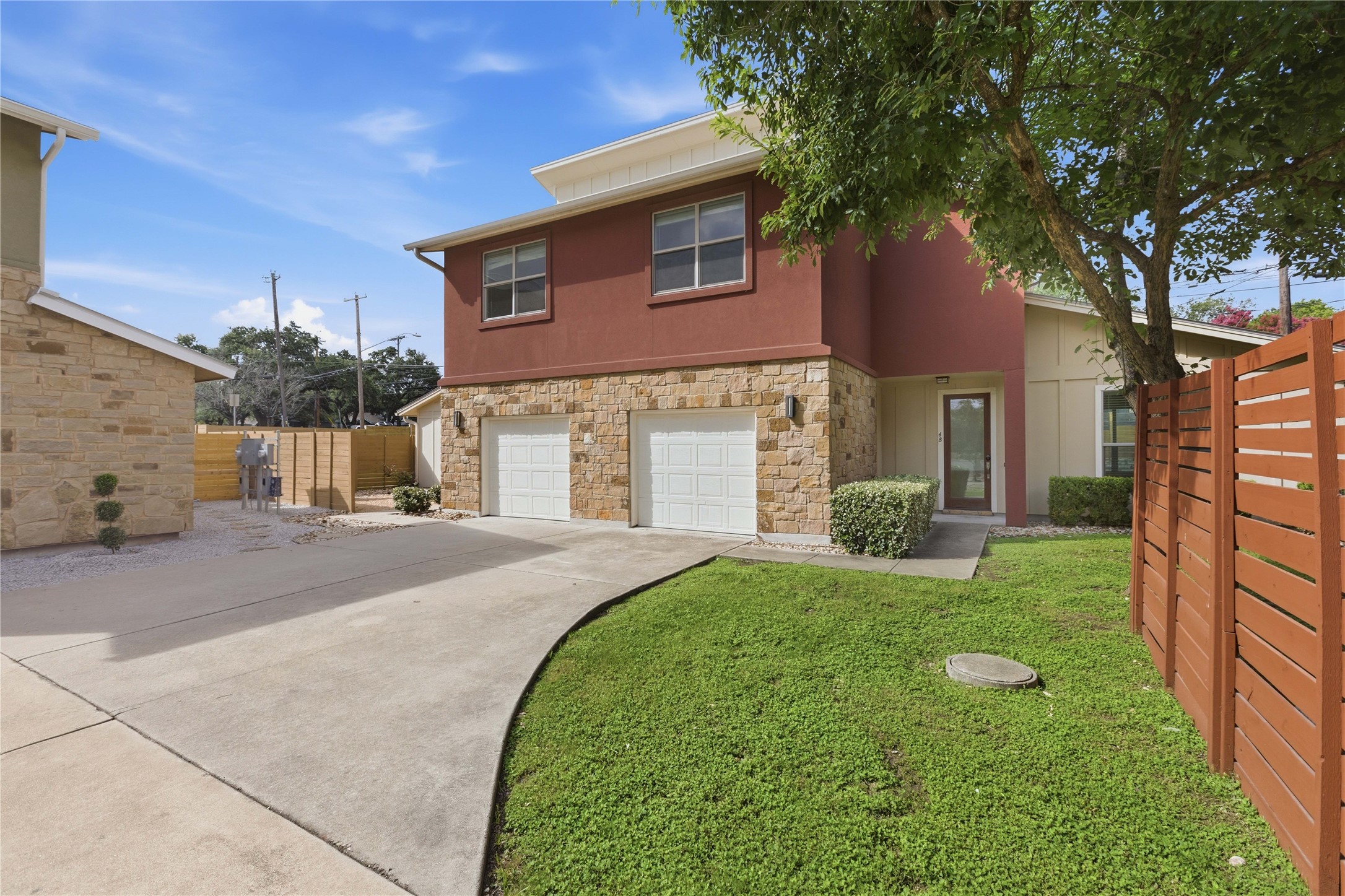 4124 Valley View Road, Unit 4A & 4B Austin, TX 78704 - Photo 1 of 40 A striking two-story home with a mix of modern and rustic elements, featuring a well-kept lawn and private fencing.