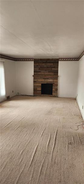 25 Kay Street Uniontown, PA 15401 - Photo 3 of 9 a view of an empty room with a fireplace