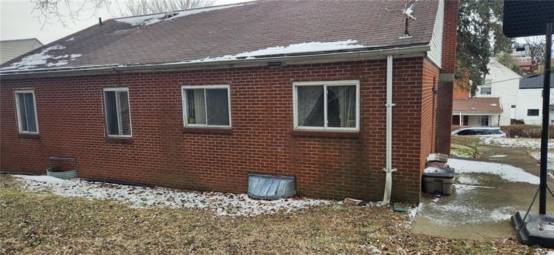 25 Kay Street Uniontown, PA 15401 - Photo 8 of 9 a view of a brick house with many windows