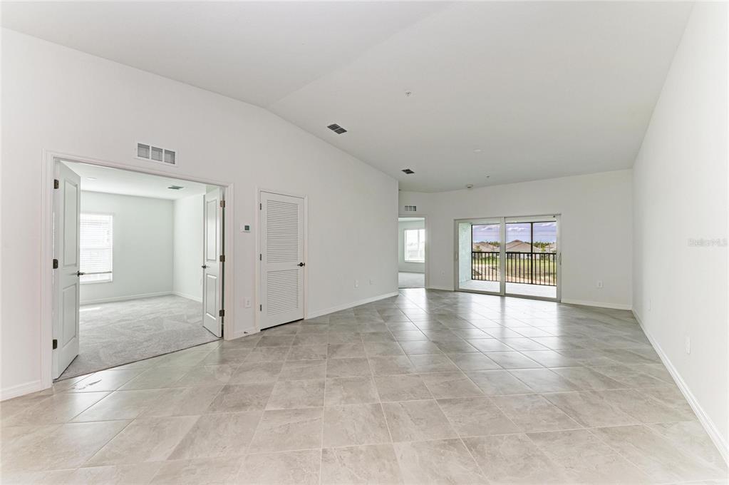 19015 Scallop Loop, Unit 7121 Lakewood Ranch, FL 34211 - Photo 11 of 48 a view of a livingroom with wooden floor and a window