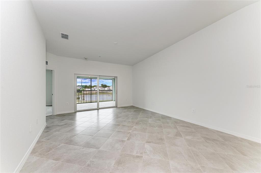 19015 Scallop Loop, Unit 7121 Lakewood Ranch, FL 34211 - Photo 13 of 48 a view of an empty room with a window