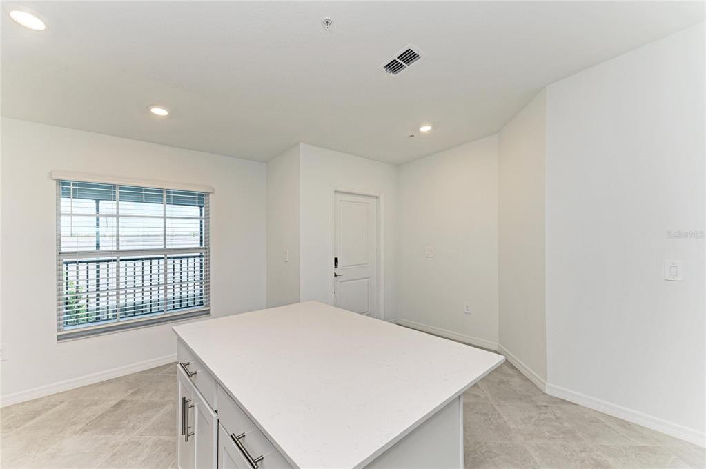 19015 Scallop Loop, Unit 7121 Lakewood Ranch, FL 34211 - Photo 25 of 48 a view of an empty room with a window