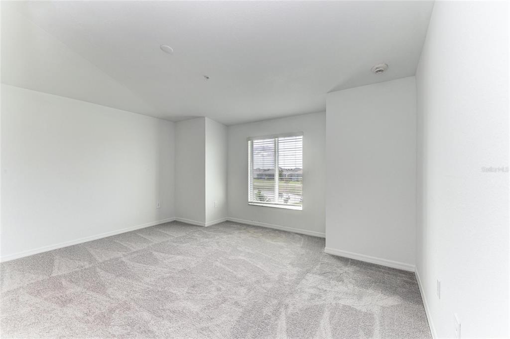 19015 Scallop Loop, Unit 7121 Lakewood Ranch, FL 34211 - Photo 27 of 48 a view of an empty room with a window