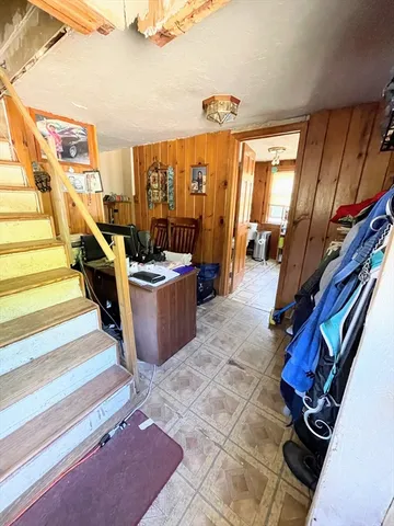 a living room with couches chairs and a rug