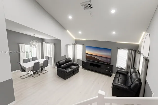 a living room with furniture gym equipment and a view of living room