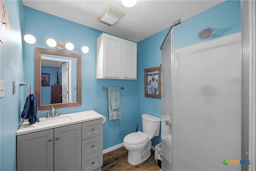 204 Brooks Road Victoria, TX 77904 - Photo 13 of 22 a bathroom with a toilet sink and mirror