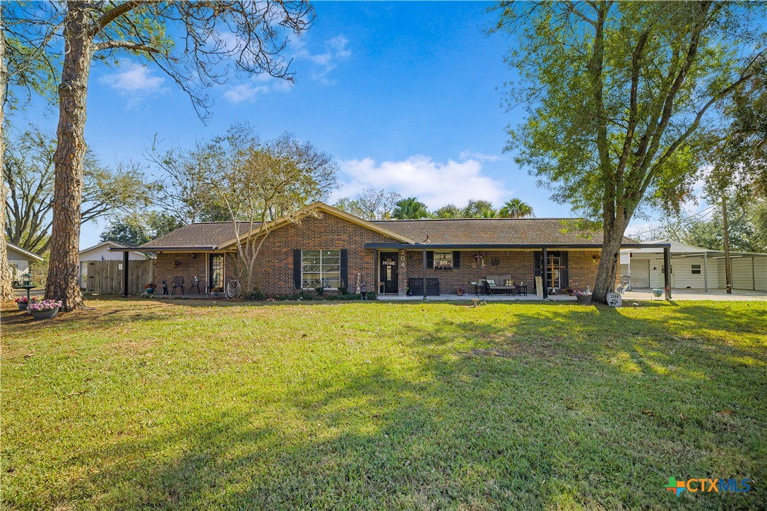 204 Brooks Road Victoria, TX 77904 - Photo 18 of 22 a front view of a house with a garden