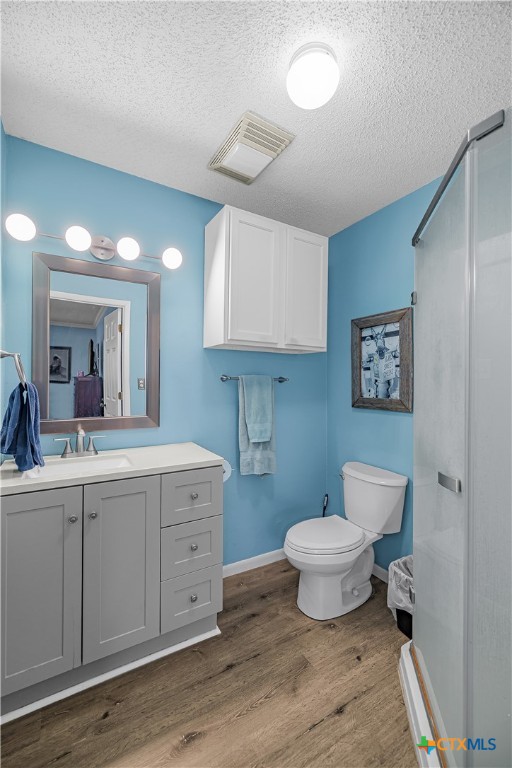 204 Brooks Road Victoria, TX 77904 - Photo 3 of 22 a bathroom with a toilet a sink and mirror