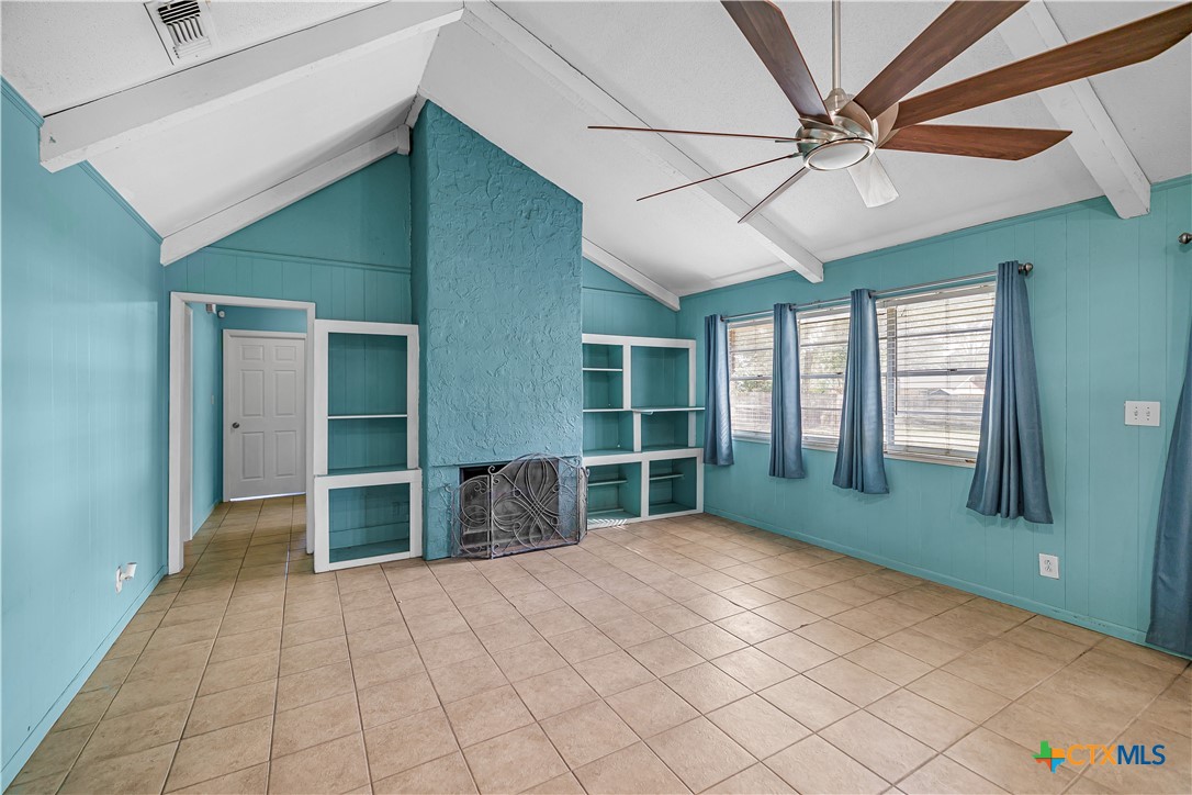 204 Brooks Road Victoria, TX 77904 - Photo 8 of 22 an empty room with ceiling fan and window