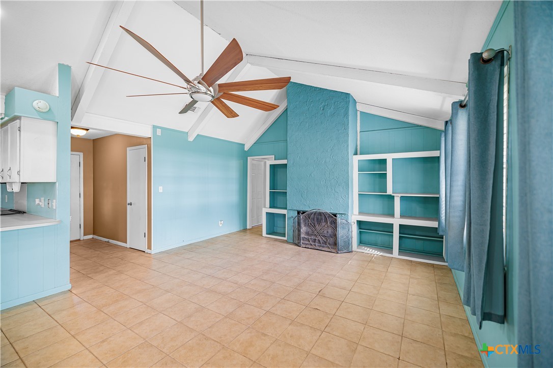 204 Brooks Road Victoria, TX 77904 - Photo 9 of 22 a view of empty room with a ceiling fan and a window