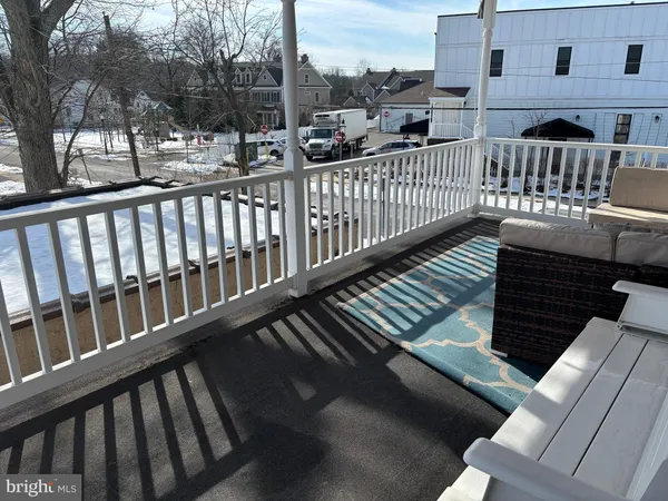 a view of balcony with furniture