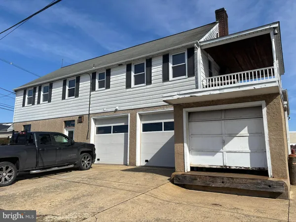a front view of a house with a garage